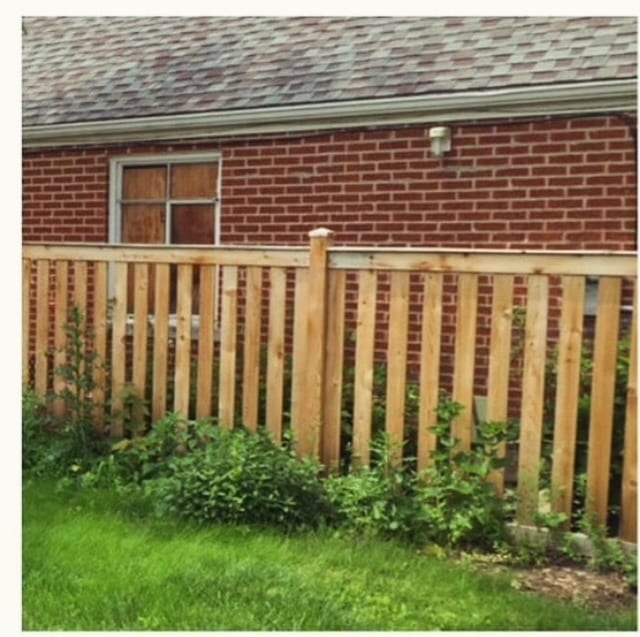 Cedar fence restored before